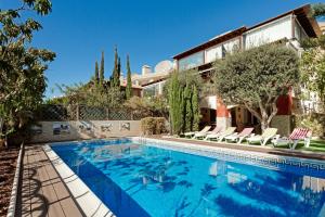 a swimming pool in front of a house at Villa Private Pool Los Cristianos in Los Cristianos