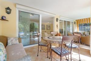 a living room with a table and chairs at Villa Private Pool Los Cristianos in Los Cristianos