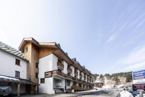 a large building in the middle of a street at L'alpin in Les Déserts