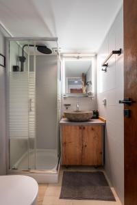 a bathroom with a sink and a shower at The Apex Boutique Studio in Athens +12 photos