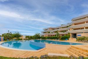 a large swimming pool in front of a building at Altea La Nova in Bernia
