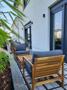 a row of benches sitting outside of a building at Apartment Schlossterrassen 4a in Pouch
