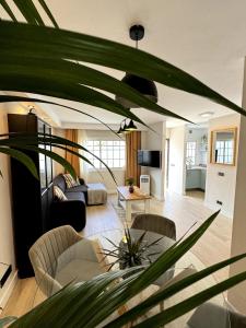 a living room with a couch and a table at Chalet Mar Y Montaña in Los Silos