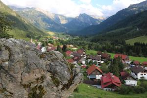 a view of a village in a valley with mountains at Allgäu Fewo Hüttenflair Bergblick in Bad Hindelang