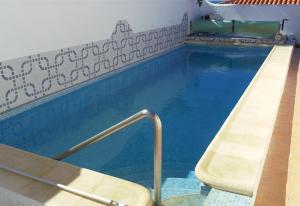 a swimming pool with a slide in the middle at Ocean View 3bedroom Villa with pool in Callao Salvaje