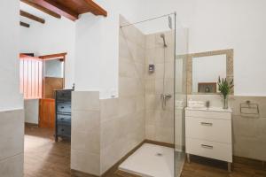 a bathroom with a shower and a sink at Casa Abuela Nicolasa in Máguez +20 photos