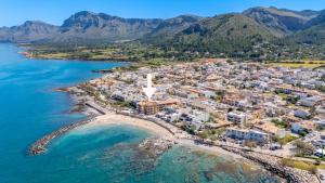 an aerial view of a town on the beach at Miramar in Artá