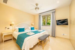 a bedroom with a large bed and a window at Villa Bellviure Luxury in Palma in Marratxí 