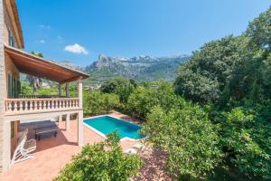 an aerial view of a house with a swimming pool at Can Guixa in Sóller