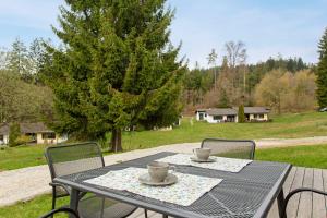 a table with two coffee cups on top at Tinyhouse Entspannung und Erholung in Untergriesbach