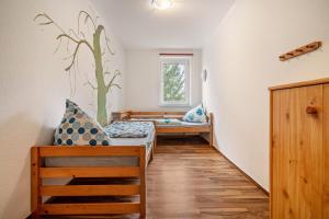 a hospital room with two beds and a window at Kolbatzer Mühle in Lychen