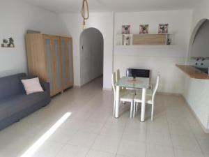 a living room with a table and a couch at Cerca plaza de Toros Vera in Vera