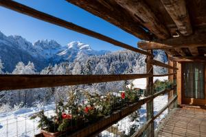 a balcony with a view of the mountains at Alpine Mood Apartments in Falcade