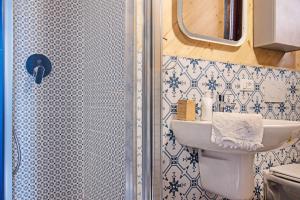 a bathroom with a shower with a sink and a toilet at Cadepaia Lago Maggiore in Laveno-Mombello