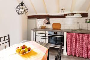 a kitchen with a table with a bowl of fruit on it at Ferienhaus Specht in Schotten