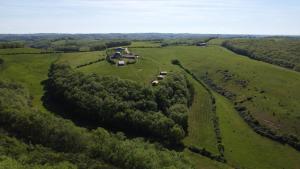 an aerial view of a farm in a field at Hitton Séjours Nature in Biran