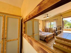 a room with a door and a bedroom with a bed at Volpe in Pitigliano +33 photos