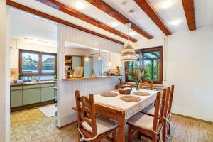 a kitchen and dining room with a table and chairs at Schwarzwald Glück in Bühl