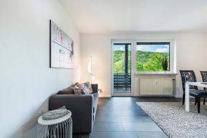 a living room with a couch and a table at Schlossblick in Egloffstein