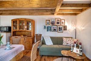 a living room with a couch and a table at Vroni in Ebersbach-Musbach