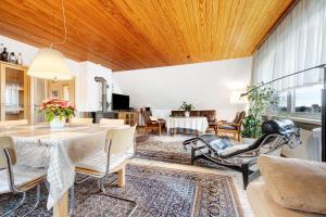 a living room with a table and chairs at Haus Erna am Deister in Barsinghausen