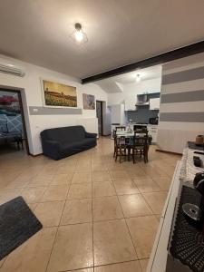 a living room with a couch and a table at Casa Domus Oppiorum in Ca degli Oppi