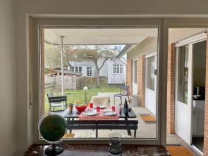 an open door to a patio with a table outside at Haus am Reithagen in Hofgeismar