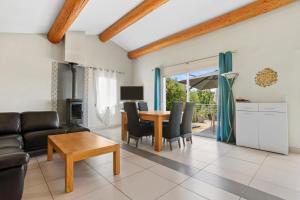a living room with a couch and a table at Villa Les Brés in Bauduen
