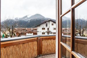 a balcony with a view of a snowy mountain at Appartement by Blahut Vacation - og in Ehrwald