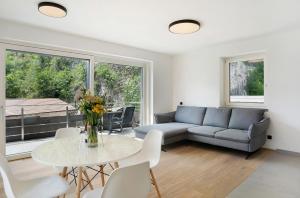 a living room with a couch and a table at Haus Weinblick Apt 5 in Magrè allʼ Adige
