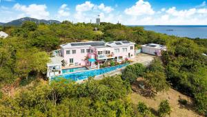 an aerial view of a house with a swimming pool at Villa Serena Water Island in Water Island