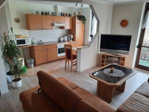 a living room with a couch and a table at Ferienwohnung Börner in Frauenstein