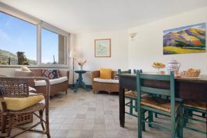 a living room with a table and chairs at Nonna Adele in Sestri Levante
