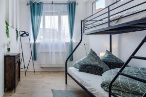 a bedroom with a bunk bed and a window at Mäxle's Loft Winzeln in Winzeln