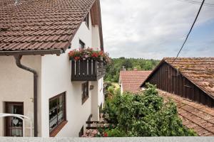 a building with a flower box on the side of it at Ferienwohnung am Blumengässle in Müllheim
