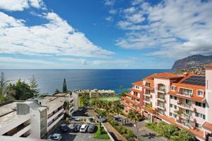 a view of the ocean from a building at Vista Formosa in Funchal