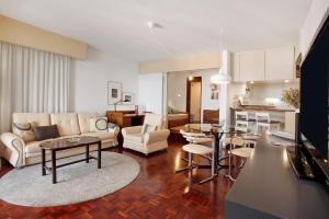 a living room with a couch and a table at Vista Formosa in Funchal