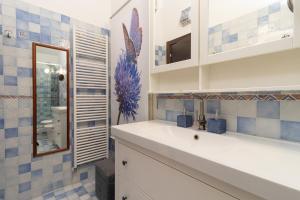 a bathroom with a sink and a mirror at Villa Lorenz in Putignano +24 photos
