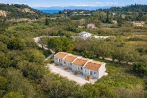 an aerial view of a house in a field at Elysium Living in Gouvia