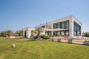 a large house with a lawn in front of it at Villa Canutells Ref 27 in Mahón