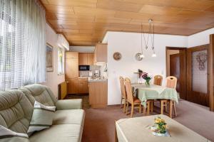a living room with a couch and a table at Haus Zur Laterne in Willingen