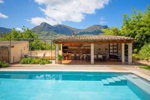 a house with a swimming pool and a gazebo at Villa Rae in Sóller