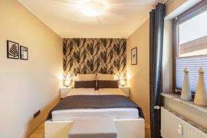 a bedroom with a bed and a window at Marla in Lauterbach