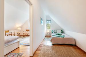 a bedroom with a bed and a mirror at Landhaus im Garten in Hude