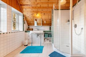 a bathroom with a shower and a sink at Landhaus im Garten in Hude +29 photos