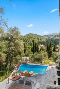 a swimming pool with a view of a mountain at Doliva Studio with private pool in Agios Gordios