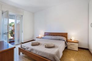 a bedroom with a bed with two pillows on it at Iris Apartment Lago Maggiore in Angera