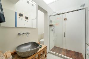 a bathroom with a sink and a shower at Apartamentos Puntagrande in Frontera +54 photos