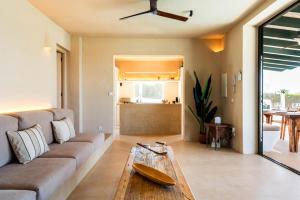 a living room with a couch and a table at Binimadi in Binisafua