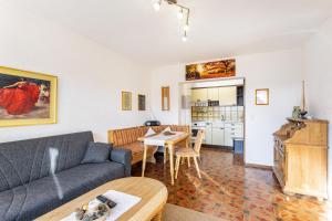 a living room with a couch and a table at Ferienoase Balve in Balve